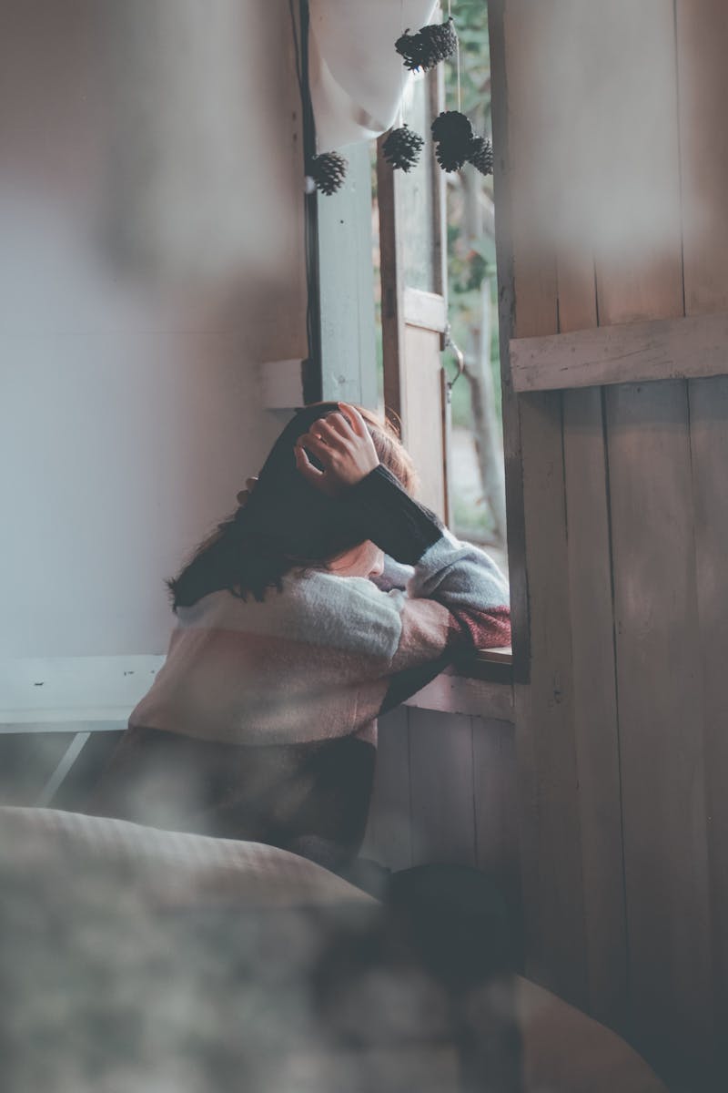 A person sitting alone with their thoughts after a difficult conversation